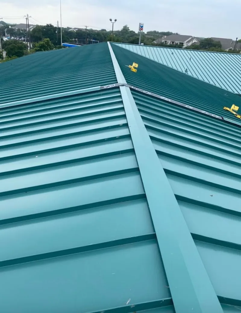 Green commercial metal roof ridge and valley for Metal Roof Repair in Nottingham